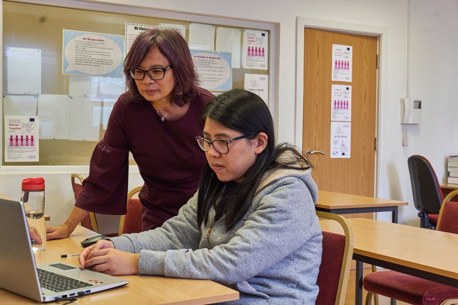 Female Tutor Teaching A Girl Student